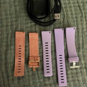Fitbit watch bands and charger.